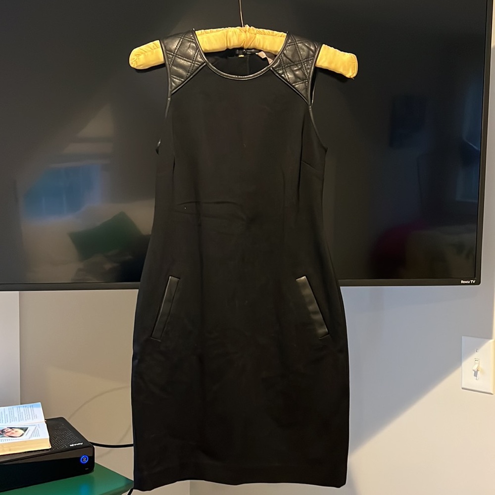 Banana trouble black mini dress with pockets and leather shoulder straps